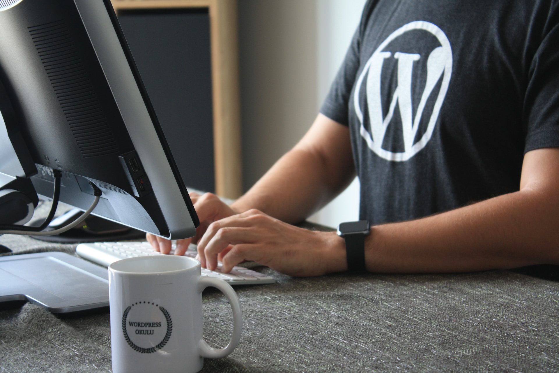 A dude wearing a WordPress t-shirt